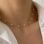 Women's necklace with pearl-embroidered pendant.