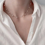 Women's necklace with pearl-embroidered pendant.